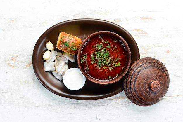 Beet borsch with lard and sour cream Ukrainian cuisine Top view free space for your text Rustic style