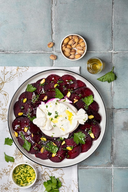 Beetroot carpaccio with mozzarella burrata and pistachios