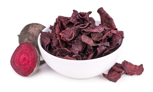 Beetroot Chips as detailed closeup shot isolated on white background selective focus