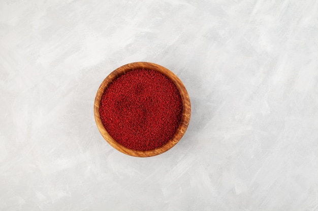 Beetroot couscous in wooden bowl top view Selective focus copy space