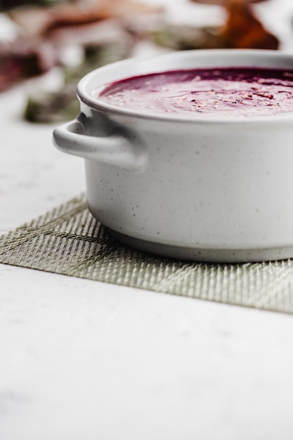 Beetroot cream soup in a ceramic dish