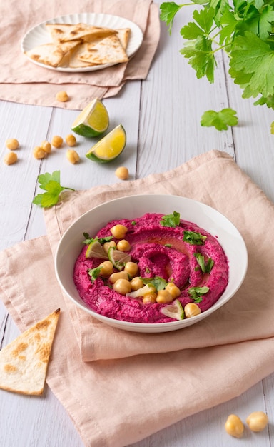 Beetroot hummus on white wooden table