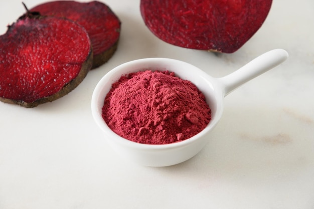 Beetroot powder for cooking healthy beverage in bowl and beetroot vegetable