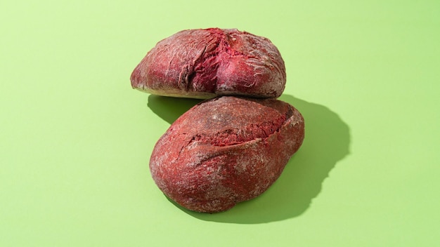 Beetroot purple buns on green background