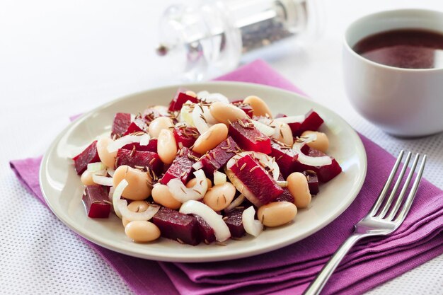 Beetroot salad with white kidney beans pickles and onion