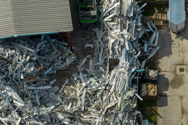 Beg pile of scrap aluminum metal siding from ruined houses after hurricane Ian swept through Florida Recycle of broken parts of mobile homes