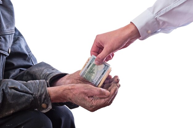 A beggar receiving money from a kind manu Isolated on white background with clipping path included