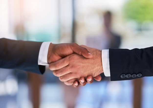 The beginning of a business empire Cropped shot of two businessmen shaking hands