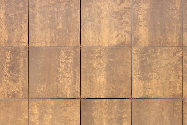 Photo beige-brown tile squares on wall