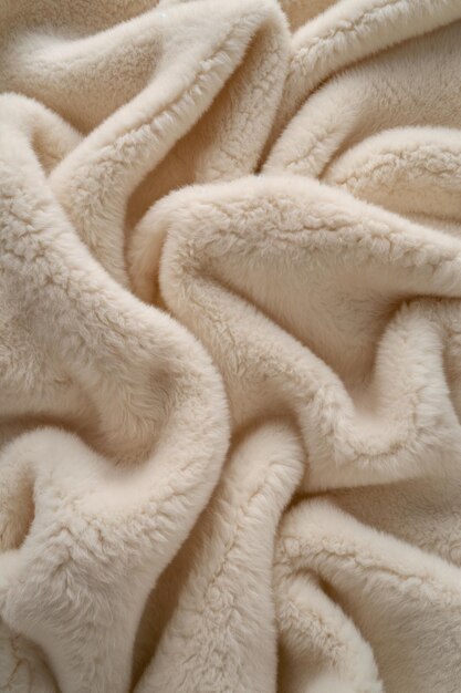 Beige fabric texture closeup with folded layers revealing inner details Soft and natural material