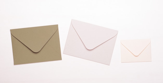 Beige and white envelopes on a white isolated