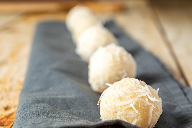 beijinho, traditional brazilian sweet dessert with coconut and cream milk