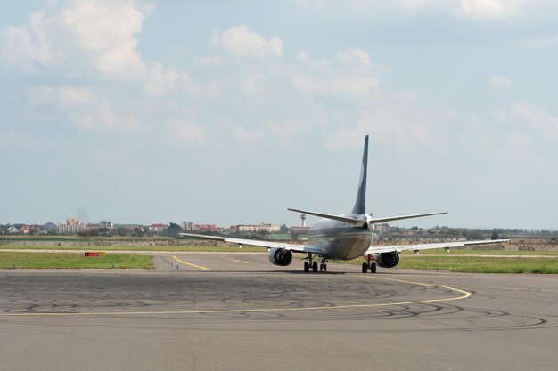 Belarus Minsk July 3 2021 Emergency landing of an aircraft A mechanic and airport maintenance staff are standing next to the plane on the runway Diagnostics of the aircraft before takeoff