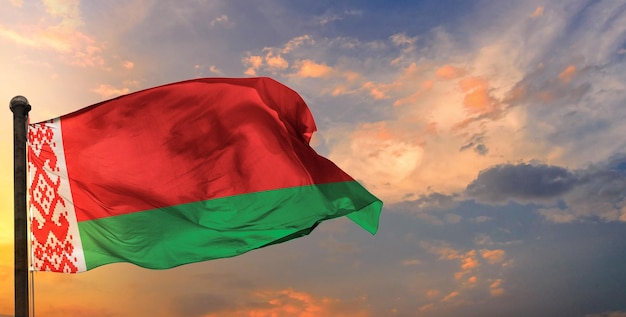 The belarus waving flag and sky background.