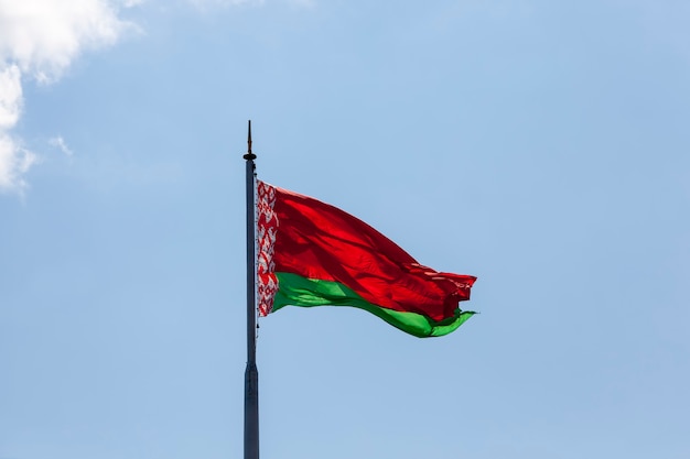 Belarusian state flag on a blue sky