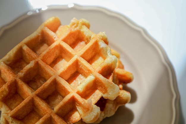 Belgian waffle with chocolate spread. Wafers. Dessert. American waffles. We made waffles at home.