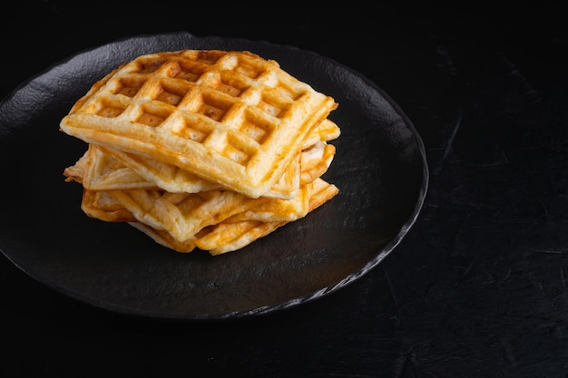 Belgian waffles on a black background