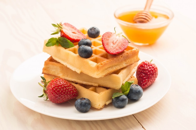 Belgian waffles with honey blueberry and strawberries