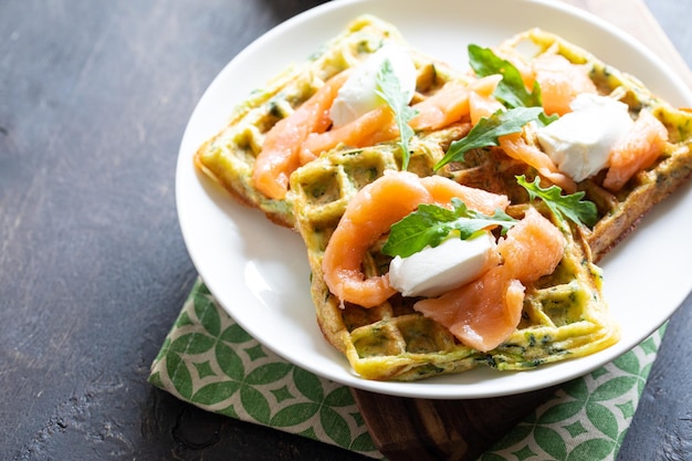 Belgian waffles with zucchini and greens with cottage cheese and salted salmon