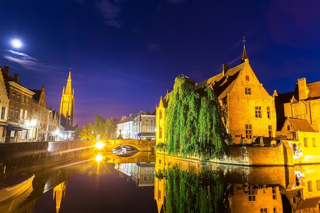 Belgium, Brugge, ancient European town with river channels, night cityscape, panoramic view. Tourism and travel, famous europe landmark, popular places