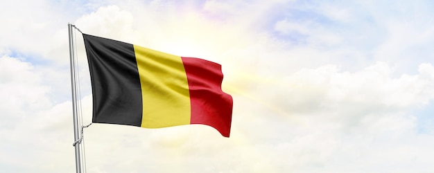 Belgium flag waving on sky background 3D Rendering