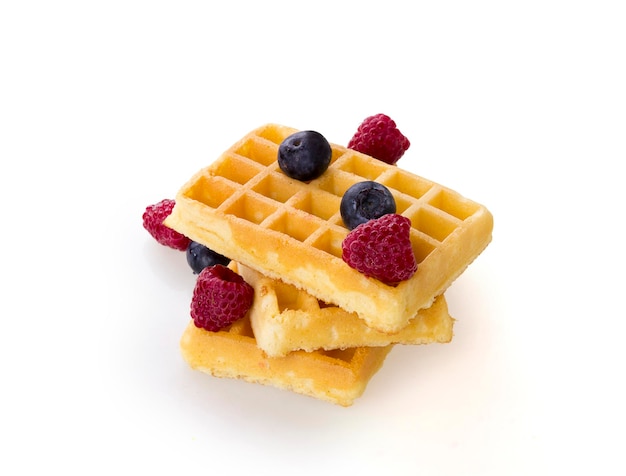 Belgium waffles with fresh berries isolated on white