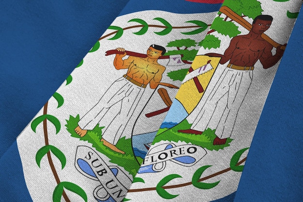 Belize flag with big folds waving close up under the studio light indoors The official symbols and colors in banner