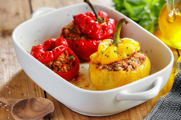 Bell pepper stuffed filled with minced meat and rice served in bowl. Closeup