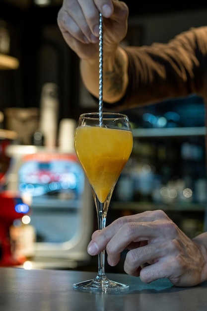 Bellini The bartender makes fresh bellini Alcoholic bellini cocktail on the bar