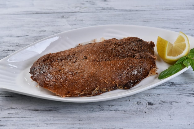 Beluga fillet in a salt crust, fish fillet baked, top view