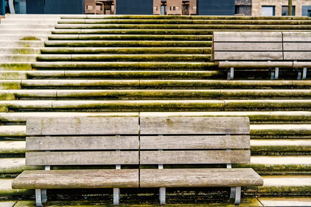 Benches on stone stairs in Hamburg, Germany. Relax, rest, seat, outdoor furniture. Architecture, structure, design style Perspective shape symmetry geometry new technologgy