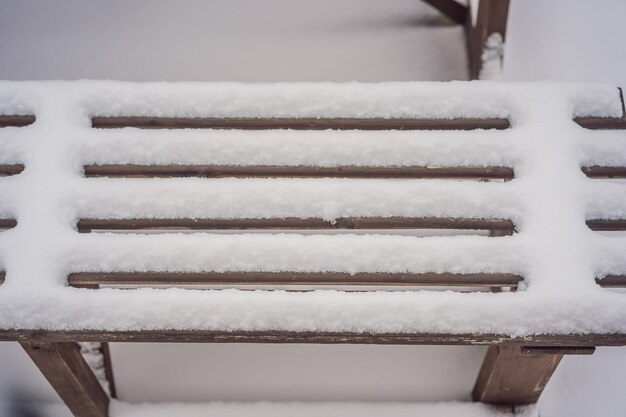 Benches in the winter city park which has been filled up with snow