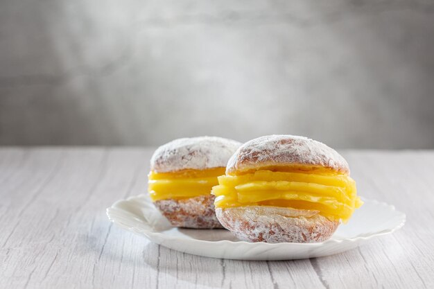 Berlin balls Bread filled with pastry cream and topped with sprinkled sugar