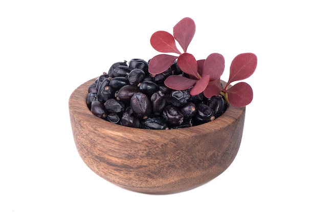 Berries of black barberry isolated on white background Spice barberry blue barberries