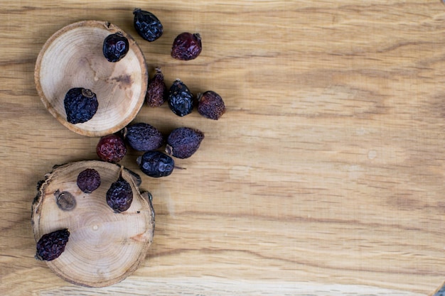 Berries of a dogrose on a wooden background