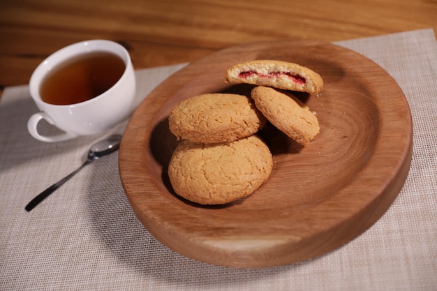 berry tea and a decorative wooden plate is very beautiful for vegetables and cookies