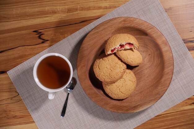 berry tea and a decorative wooden plate is very beautiful for vegetables and cookies