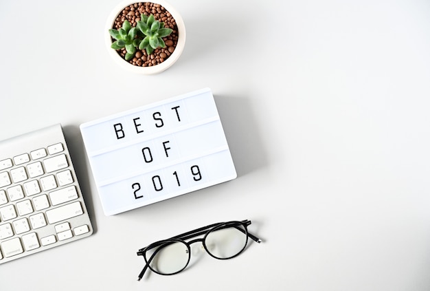 best of 2019 text on lightbox composition on white table