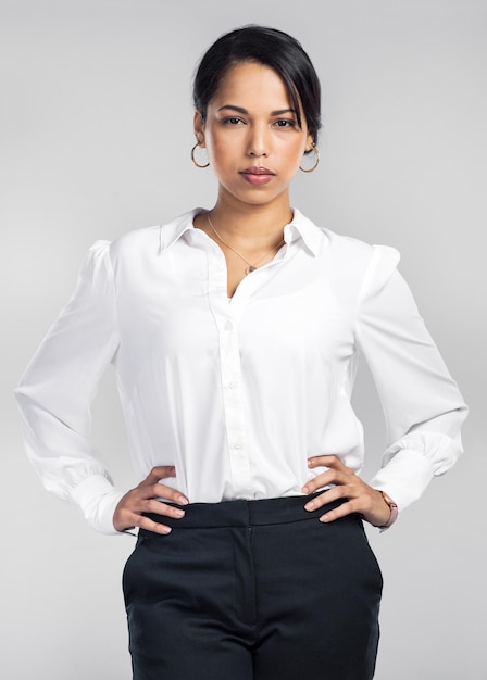 Better believe Im the boss Studio shot of a confident young businesswoman posing against a grey background