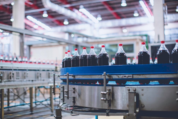 Beverage conveyor flowing with bottles