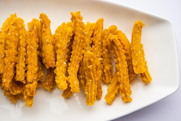 Bhajni chakli sticks or crunchy murukku snack made using diwali festival favourite munching food