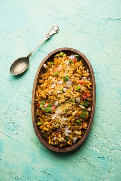 Bhelpuri Chaat or chat is a road side tasty food from India, served in a bowl or plate. selective focus