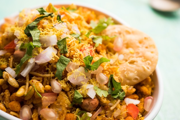 Bhelpuri Chaat or chat is a road side tasty food from India, served in a bowl or plate. selective focus