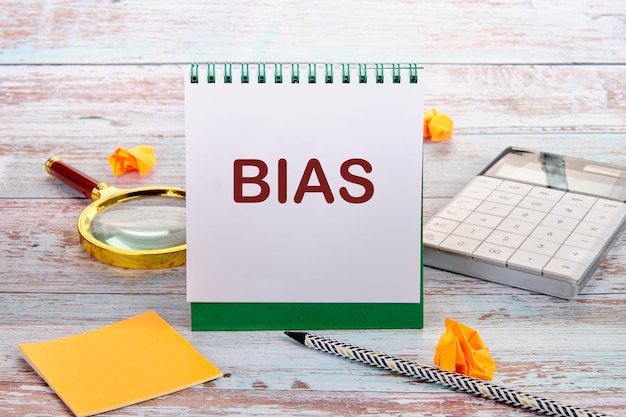 Bias is a word on a notebook the concept of personal opinion bias