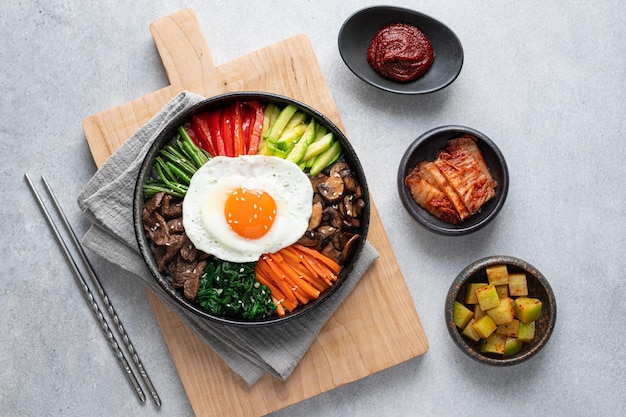 bibimbap on a concrete background traditional korean dish top view