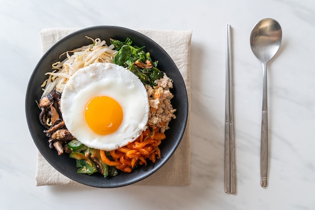 Bibimbap, Korean spicy salad with rice and fried egg