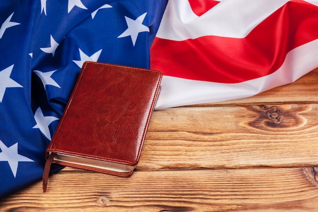 Bible laying on top of an american flag