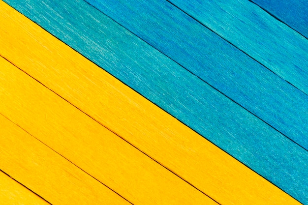 Bicolor wooden textured background in blue and yellow colours