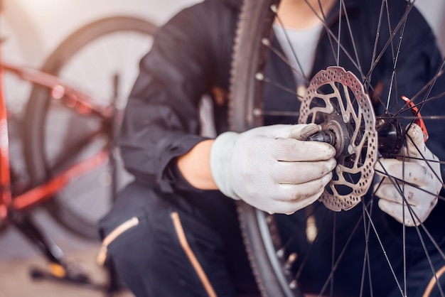 Bicycle maintenance Rider is assembling the bicycle parts Closeup