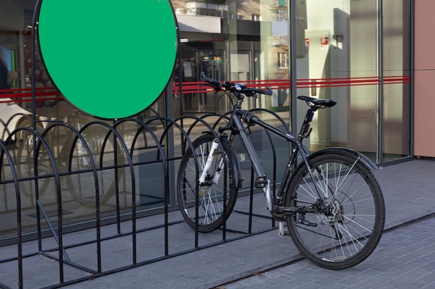 Photo bicycle parked in a bicycle parking lot plase for text